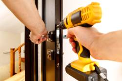 man-repairing-doorknob-handyman-repair-door-lock-room (2)